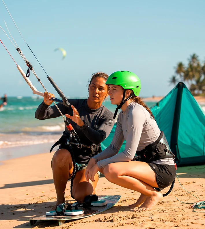 Girls on beach with kitesurf kite